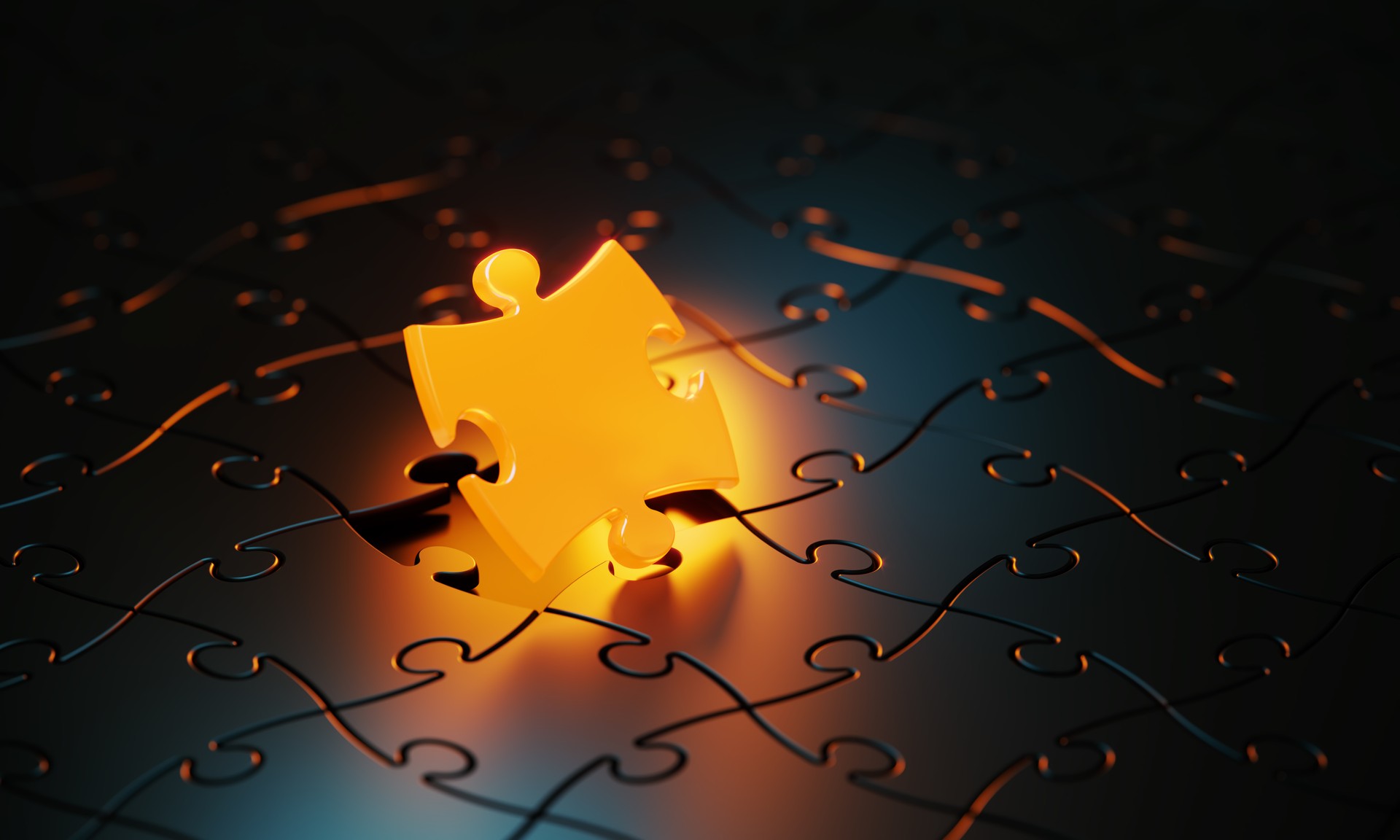 Orange Jigsaw Puzzle Piece Glowing On Black Background